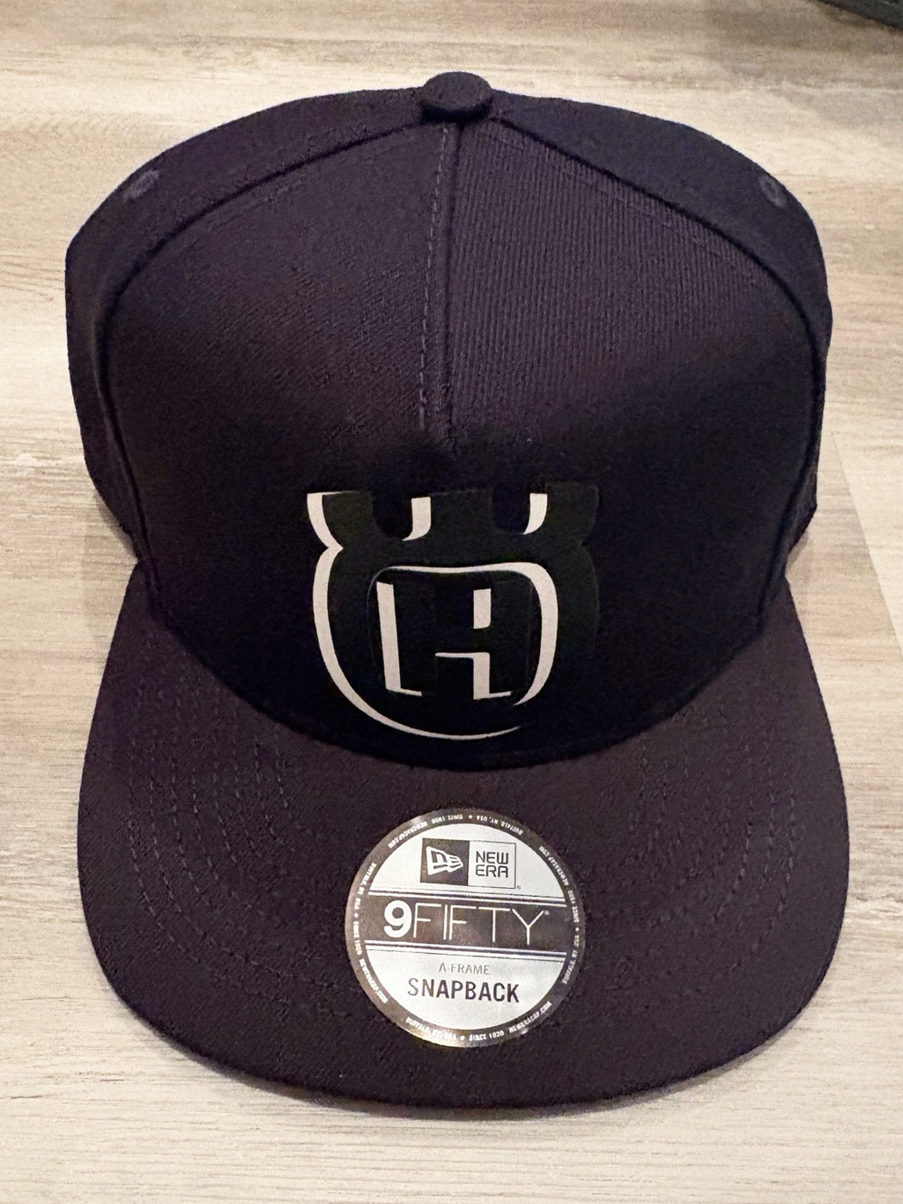 New Era 9FIFTY Black Snapback Hat with Embroidered Logo